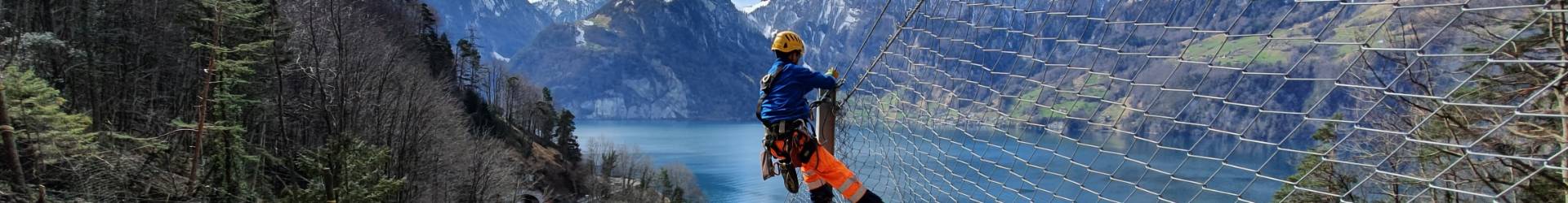 A install worker is installing the Rockcon® system for geohazard protection.