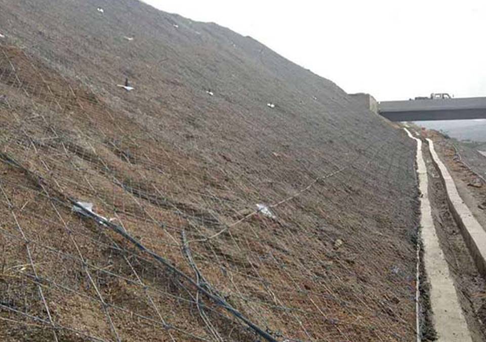 Rock surface is fully covered by rockcon mesh and reinforced rockcon rockfall barrier.