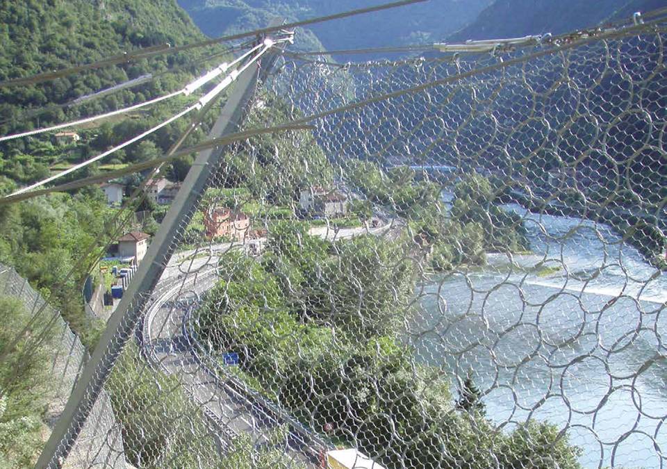 The hexagonal mesh works with ring net rockfall barrier to protect expressway along mountains.